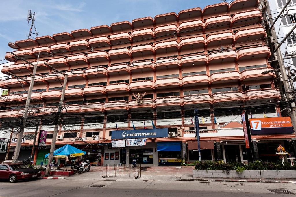 7 Stays Pattaya Hotel - Pink building with curved balconies