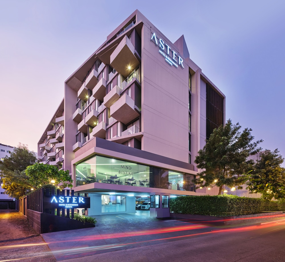 Aster Hotel and Residence - Modern building at dusk